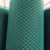 Close-up of a roll of bright green plastic mesh material with a diamond-shaped pattern.