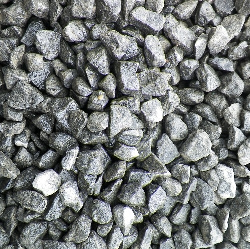 Close-up of light grey crushed stone gravel.